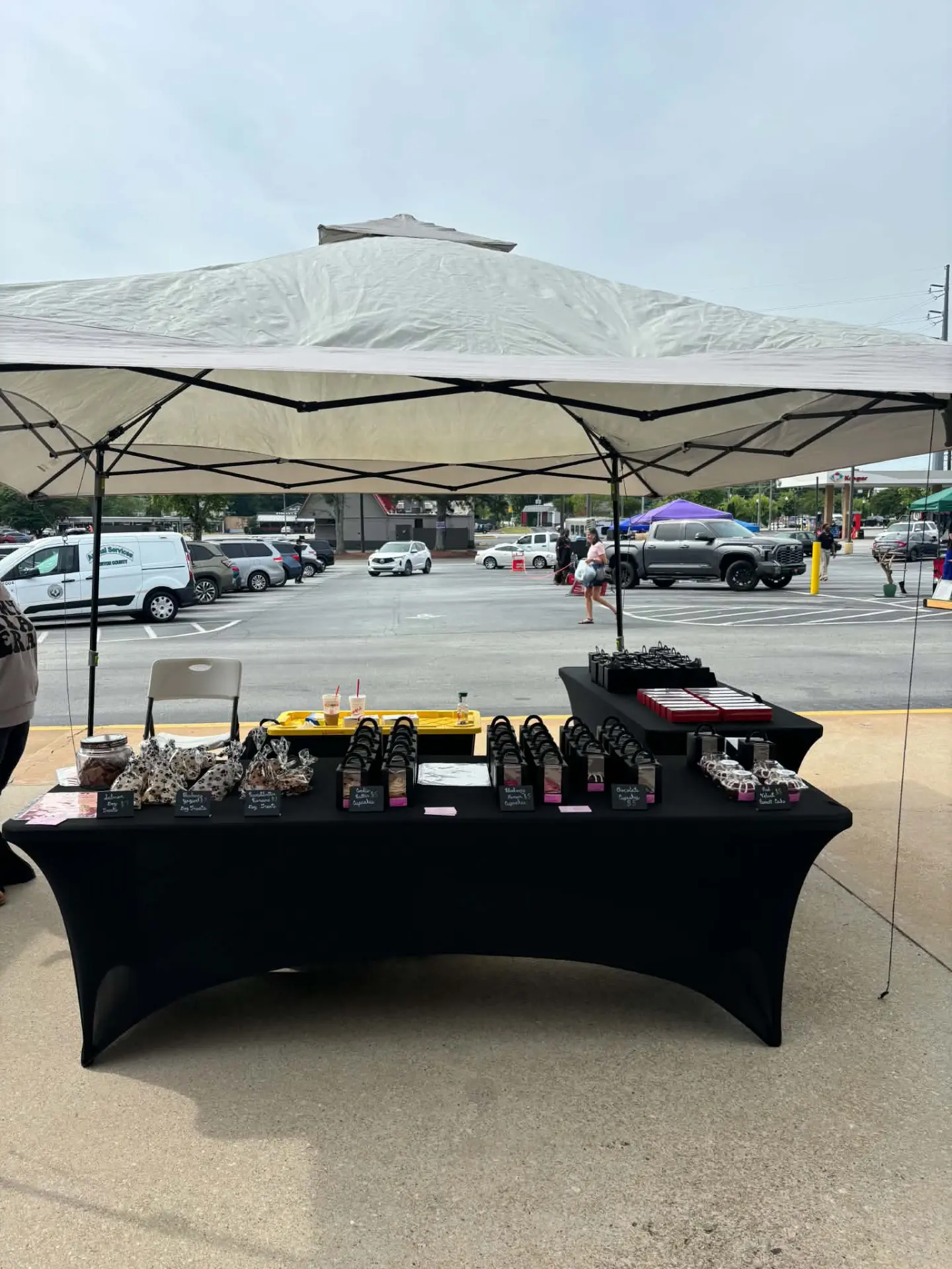 Brooke's Treats & Sweets market table set up under a tent